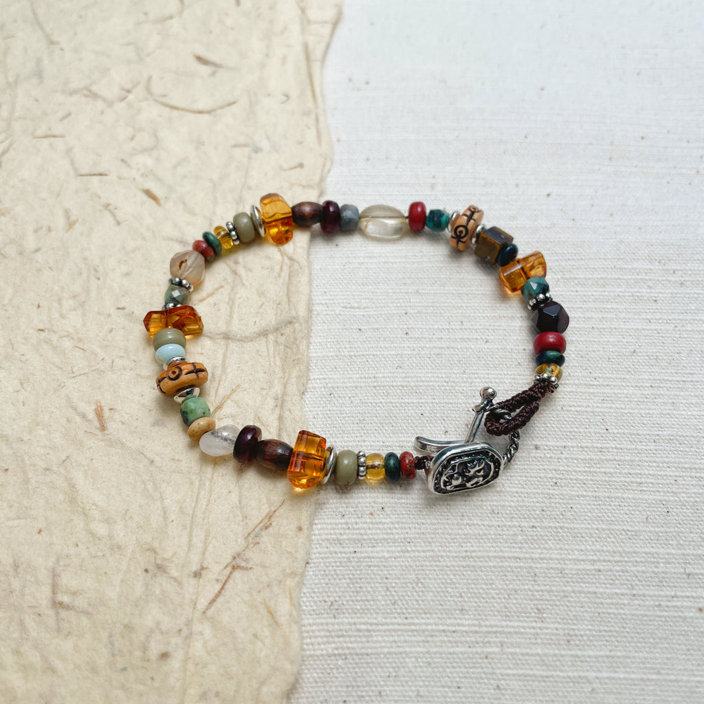 Handmade multicolor beaded bracelet with wood and stone beads, boho soul jewelry.