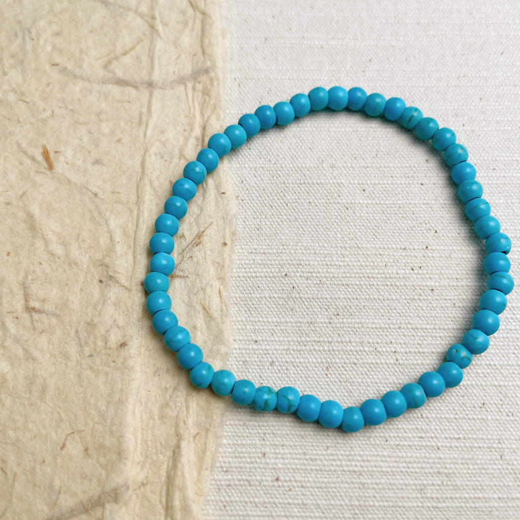 Handmade turquoise beaded bracelet with natural stones, healing energy jewelry.