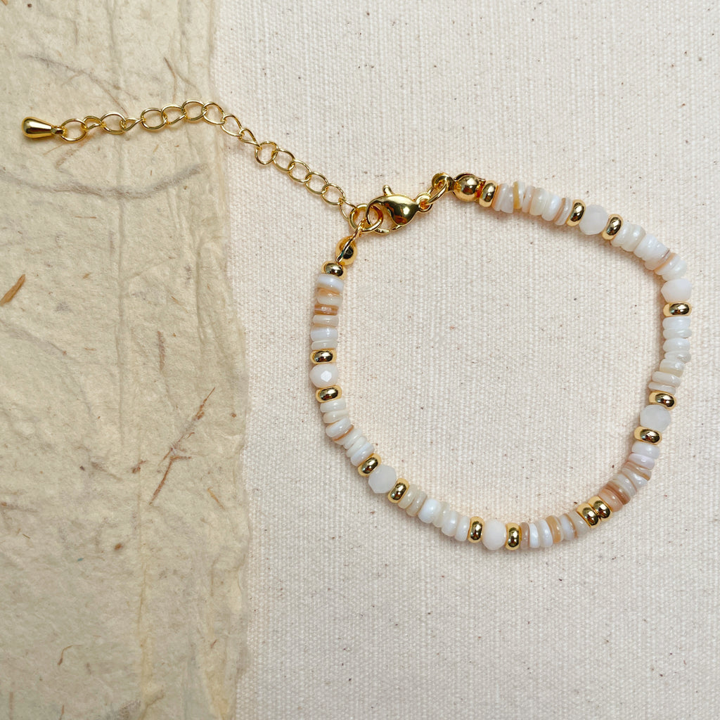 Handmade white stone bracelet with gold beads, minimalist gemstone jewelry.