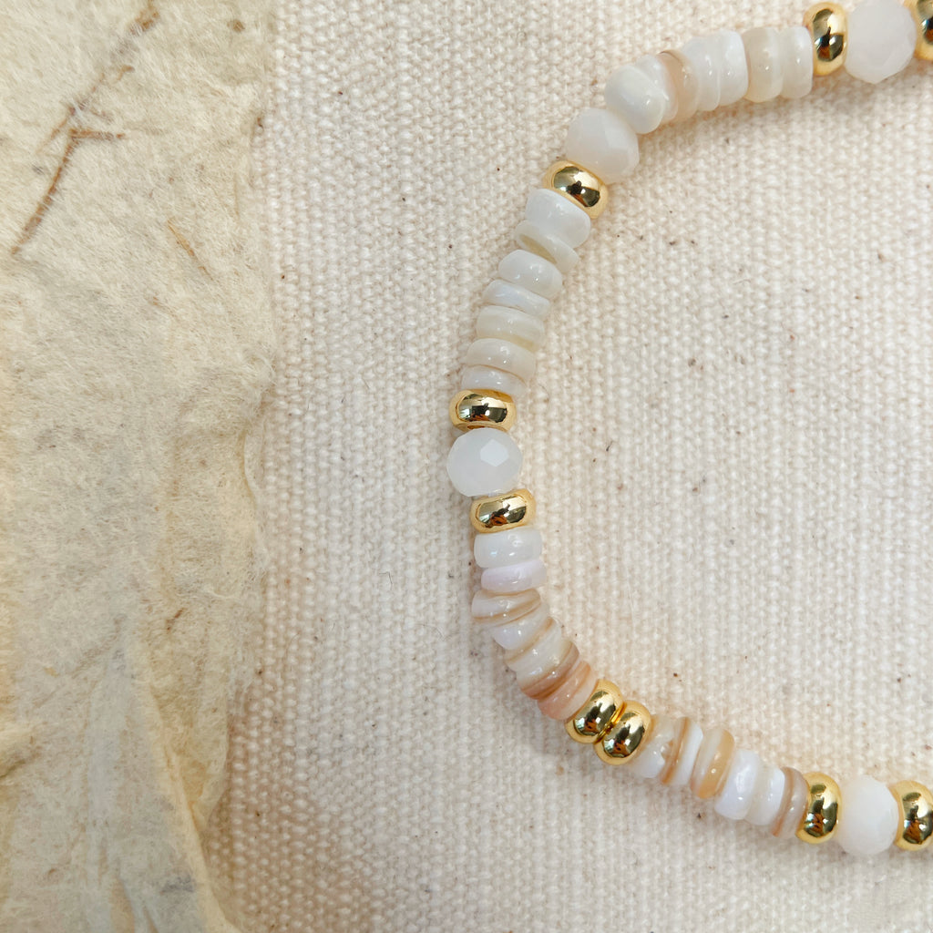 Elegant white and gold bracelet, handmade gemstone accessory for balance and serenity
