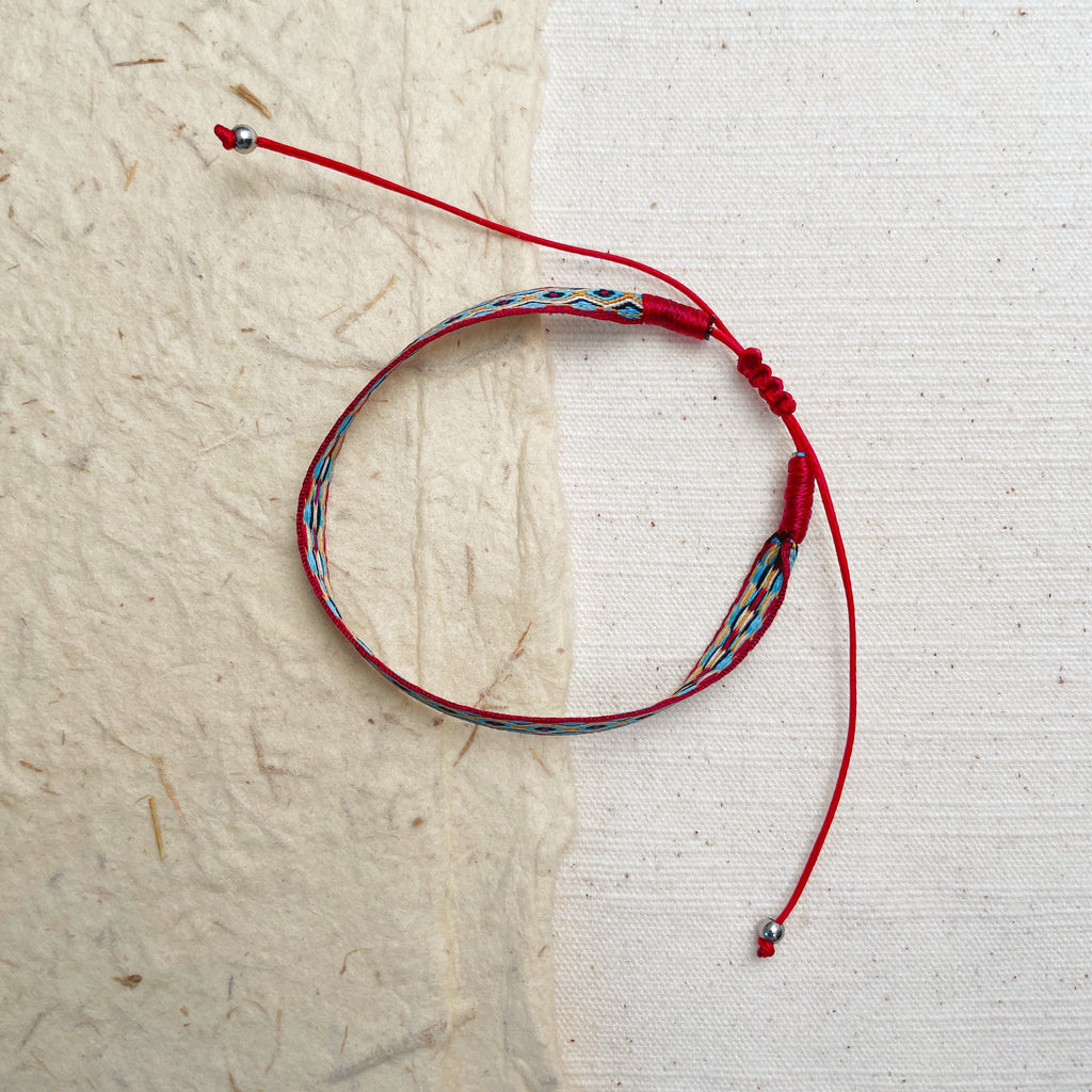 Handmade geometric woven cord bracelet, diamond pattern protection jewelry.