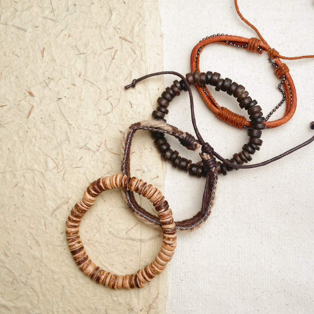 Layered hemp and wood bracelet on wrist, earthy boho style for men.