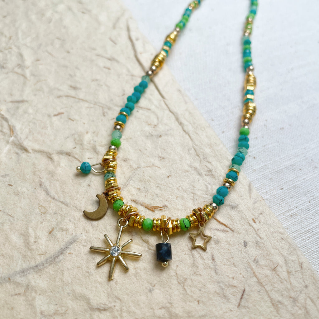 Handmade celestial beaded necklace with sun moon star charms, boho glass jewelry.